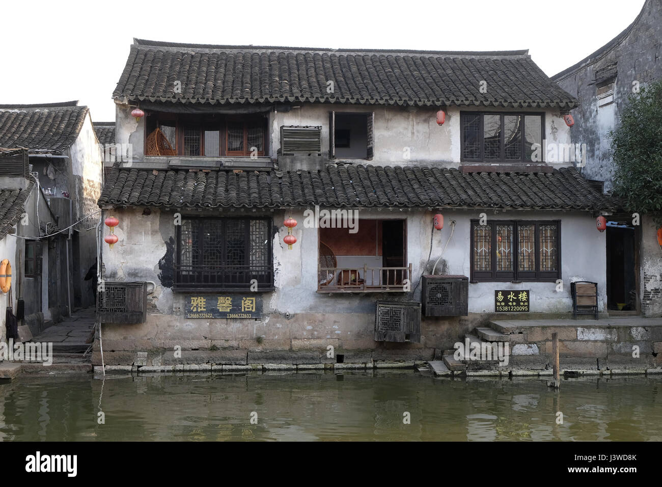 The Chinese architecture and buildings lining the water canals to Xitang town in Zhejiang Province, China, February 20, 2016. Stock Photo