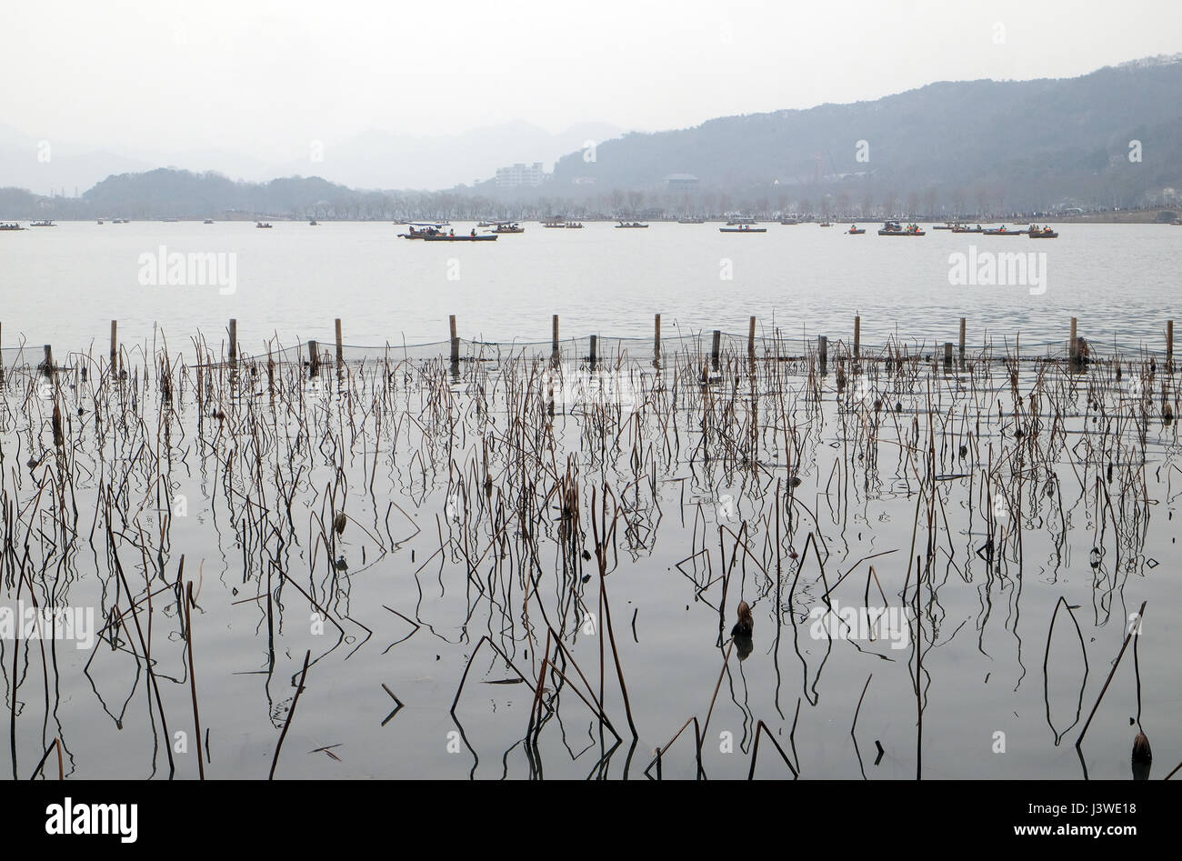 People are moving in boats on West lake in Hangzhou, China, February 21, 2016. Stock Photo