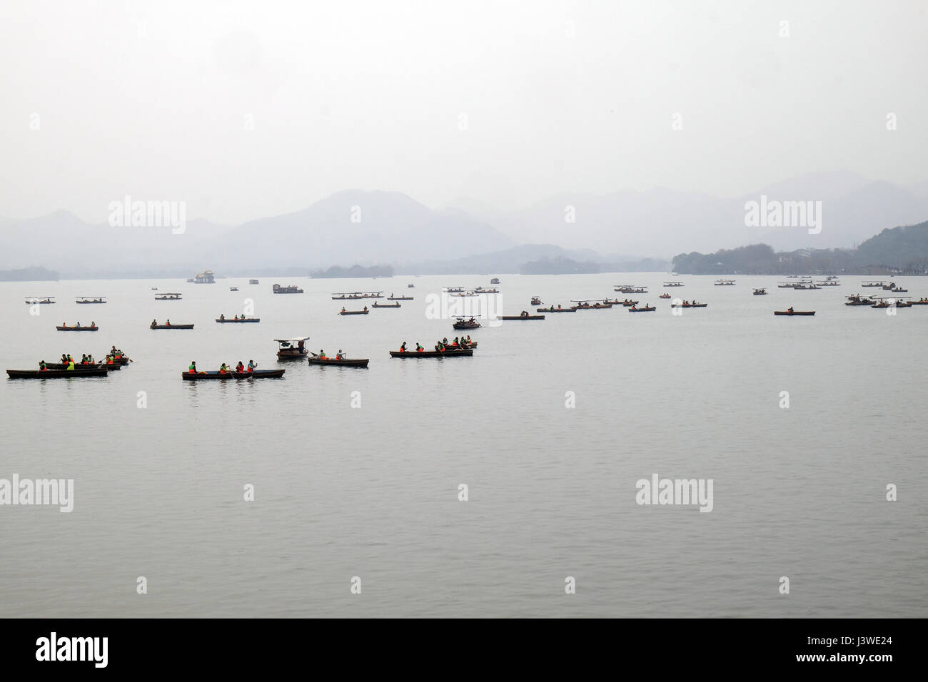 People are moving in boats on West lake in Hangzhou, China, February 21, 2016. Stock Photo