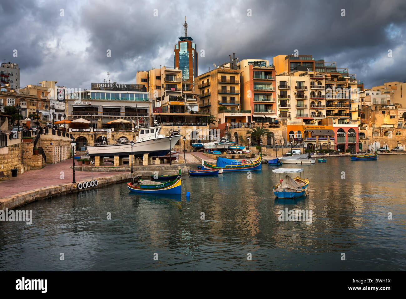 SAINT JULIAN, MALTA - JANUARY 23, 2015: Spinola Bay and Portomaso Tower in Saint Julian, Malta. The Portomaso Business Tower is 97.54 metres tall and  Stock Photo