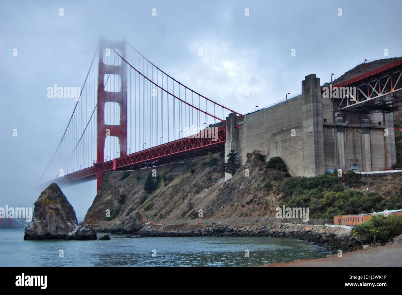 Image of the famous Golden Gate bridge in a very foggy day in San Francisco, California, USA. August 2013. Stock Photo