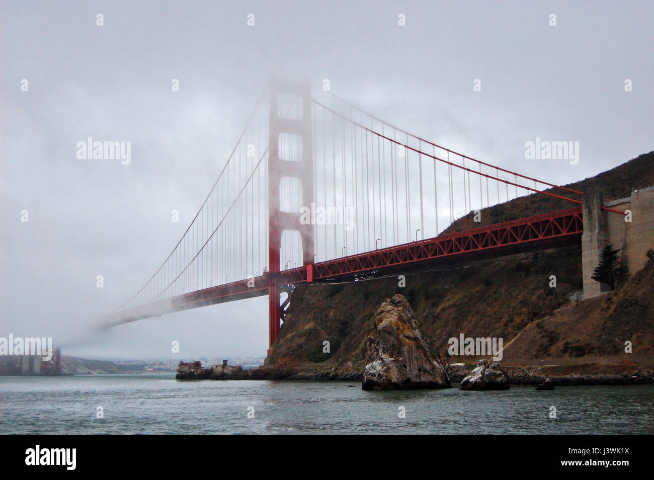 Image of the famous Golden Gate bridge in a very foggy day in San Francisco, California, USA. August 2013. Stock Photo
