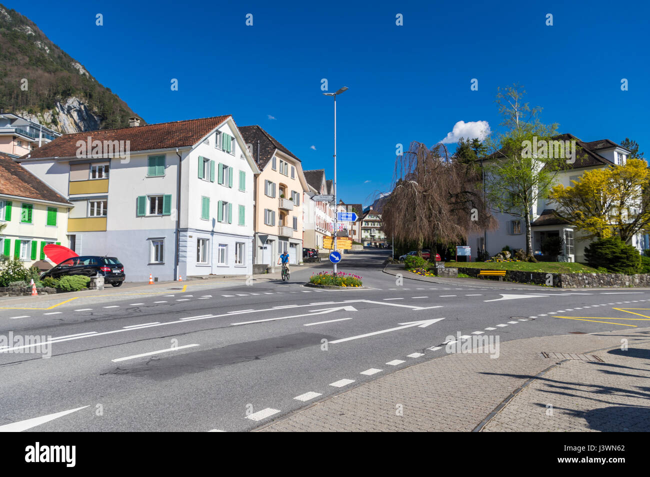 View of buildings and an intersection in the center of Gersau, a village in the canton of Schwyz, Switzerland. Stock Photo