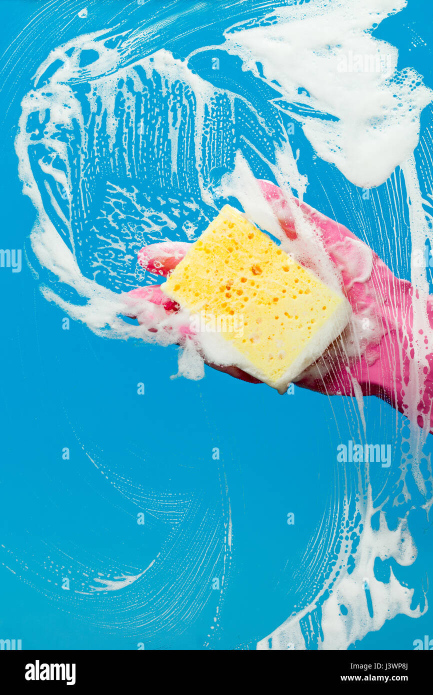 Hand with glove cleaning window Stock Photo Alamy