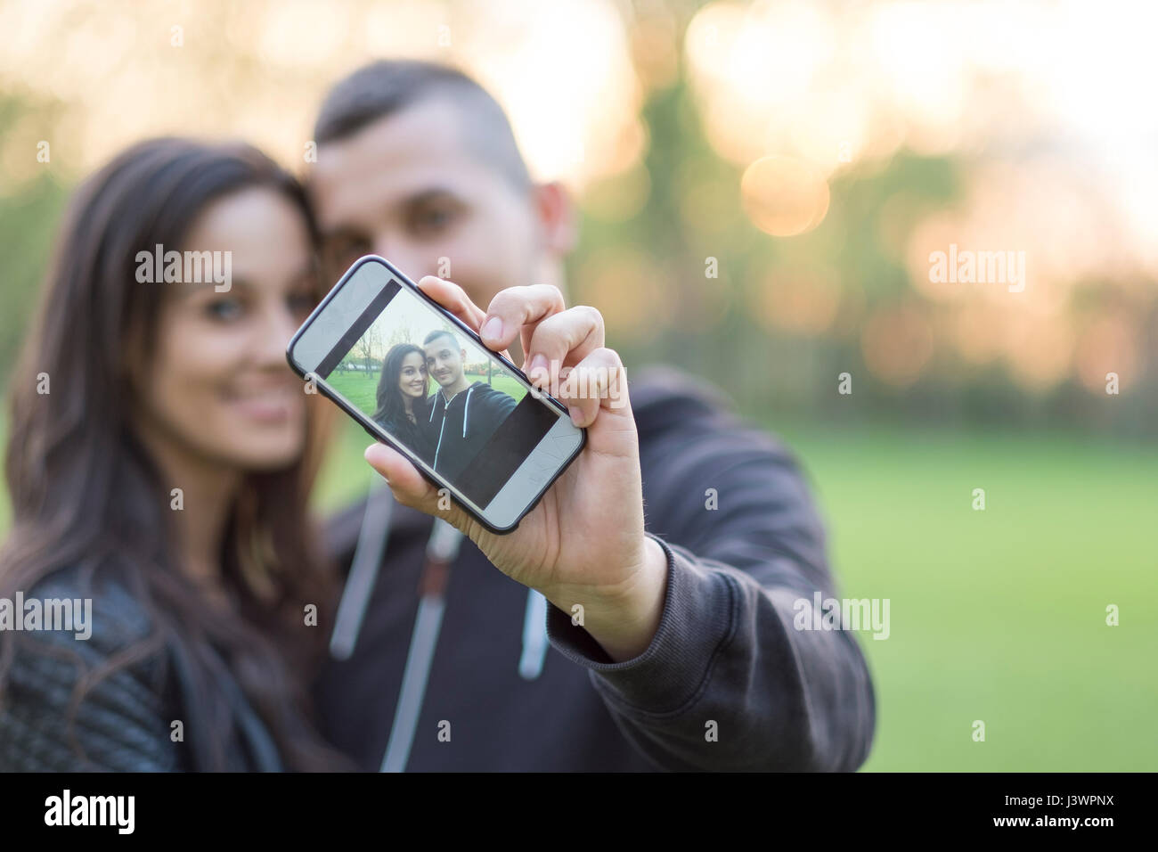 Smiling handsome man takes selfie hi-res stock photography and images ...