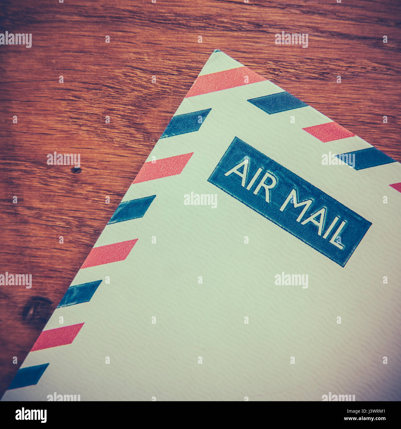 Retro Photo Of An Old Air Mail Envelope Of A Rustic Wooden Background Stock Photo