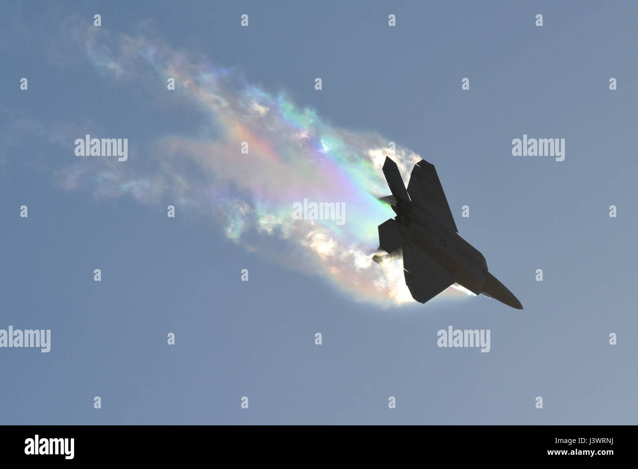 A USAF F-22 Raptor stealth tactical fighter aircraft causes massive vapor contrails in flight during the Australian Airshow and Aerospace & Defense Exposition March 3, 2017 in Geelong, Australia.    (photo by John Gordinier /US Air Force  via Planetpix) Stock Photo