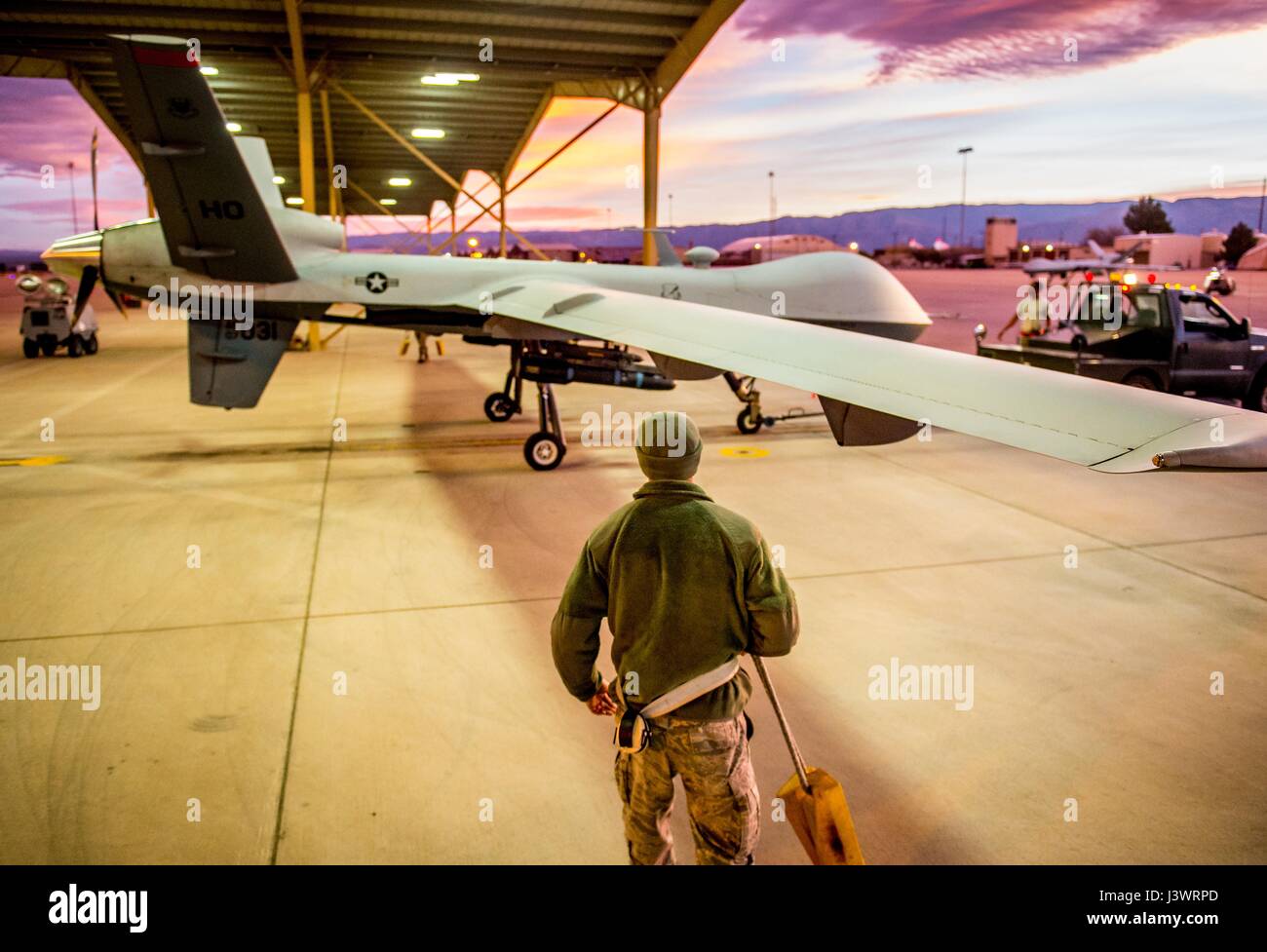 U.S. soldiers tow a USAF MQ9 Reaper unmanned aerial vehicle aircraft