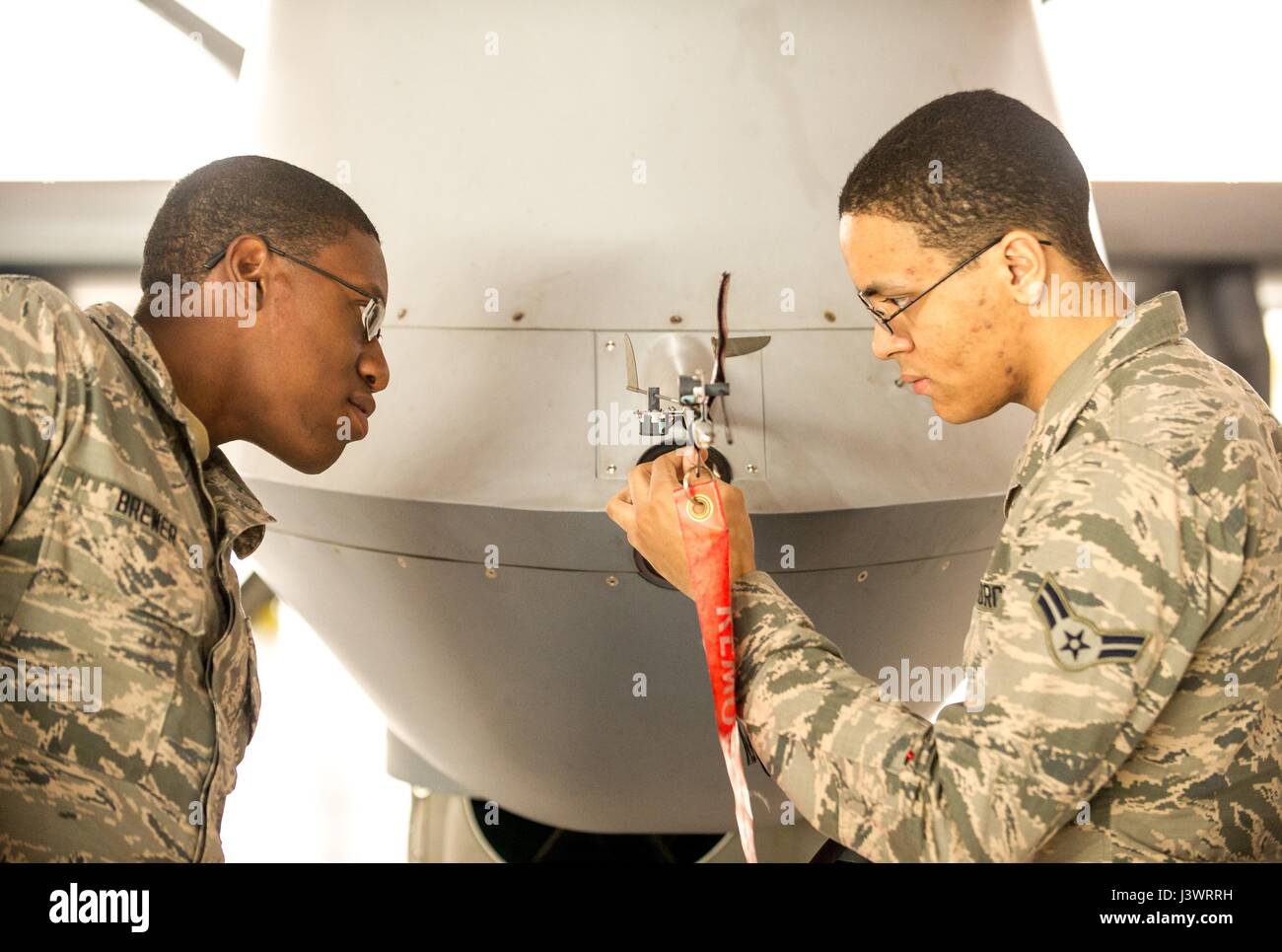 U.S. soldiers inspect a USAF MQ9 Reaper unmanned aerial vehicle