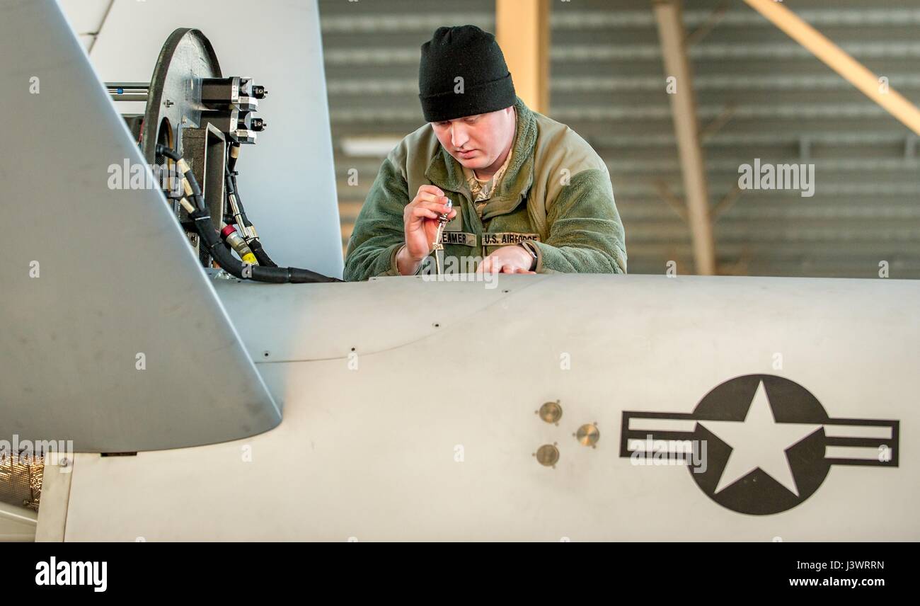 A U.S. soldier inspects a USAF MQ-9 Reaper unmanned aerial vehicle aircraft at the Holloman Air Force Base December 16, 2016 in Alamogordo, New Mexico.    (photo by J.M. Eddins Jr./US Air Force  via Planetpix) Stock Photo