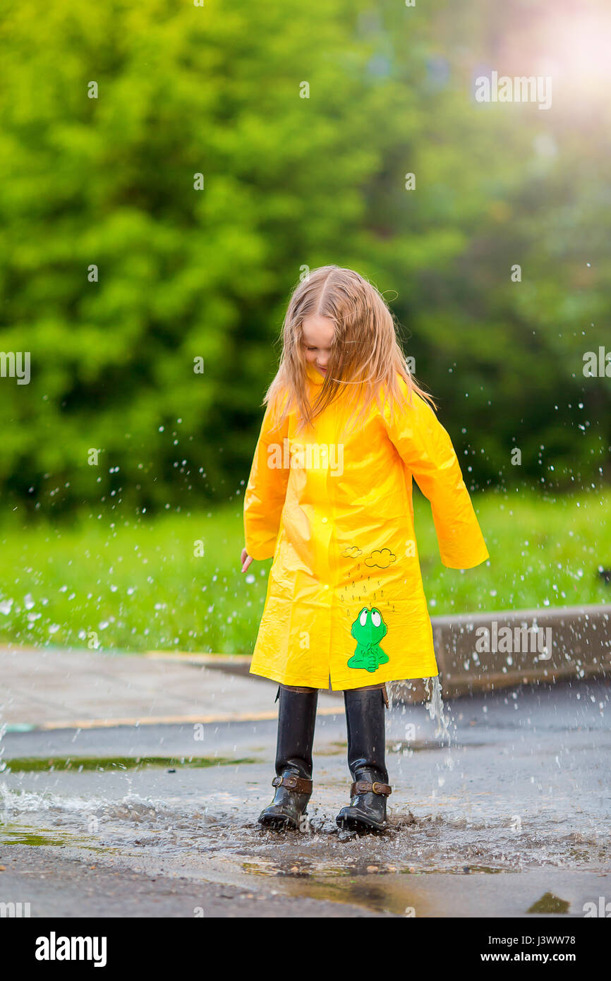 Little girl in hot sale yellow raincoat