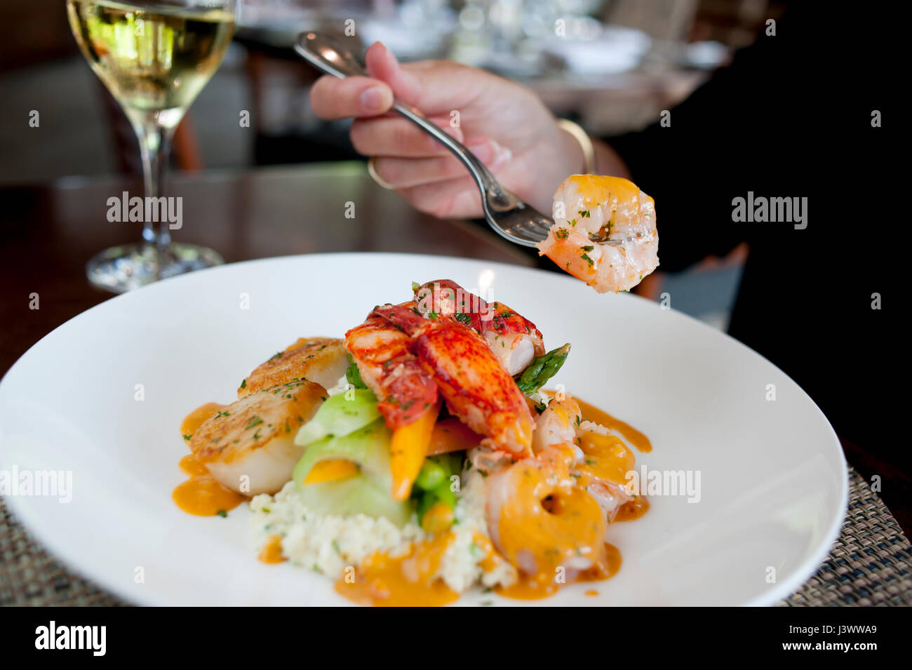 USA Food shellfish and grits at the Waypoint Seafood and Grill woman dining Williamsburg