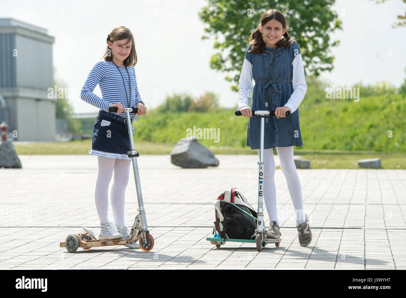 Dingolfing, Germany. 4th May, 2017. Emma Richter (l) and Angelina Goretzki from the Gymnasium Wendelstein school presents their sidecar for a scooter at the Bavarian state final of the 'Schueler experimentieren' (lit. school pupils experiment) competition in Dingolfing, Germany, 4 May 2017. Photo: Armin Weigel/dpa/Alamy Live News Stock Photo