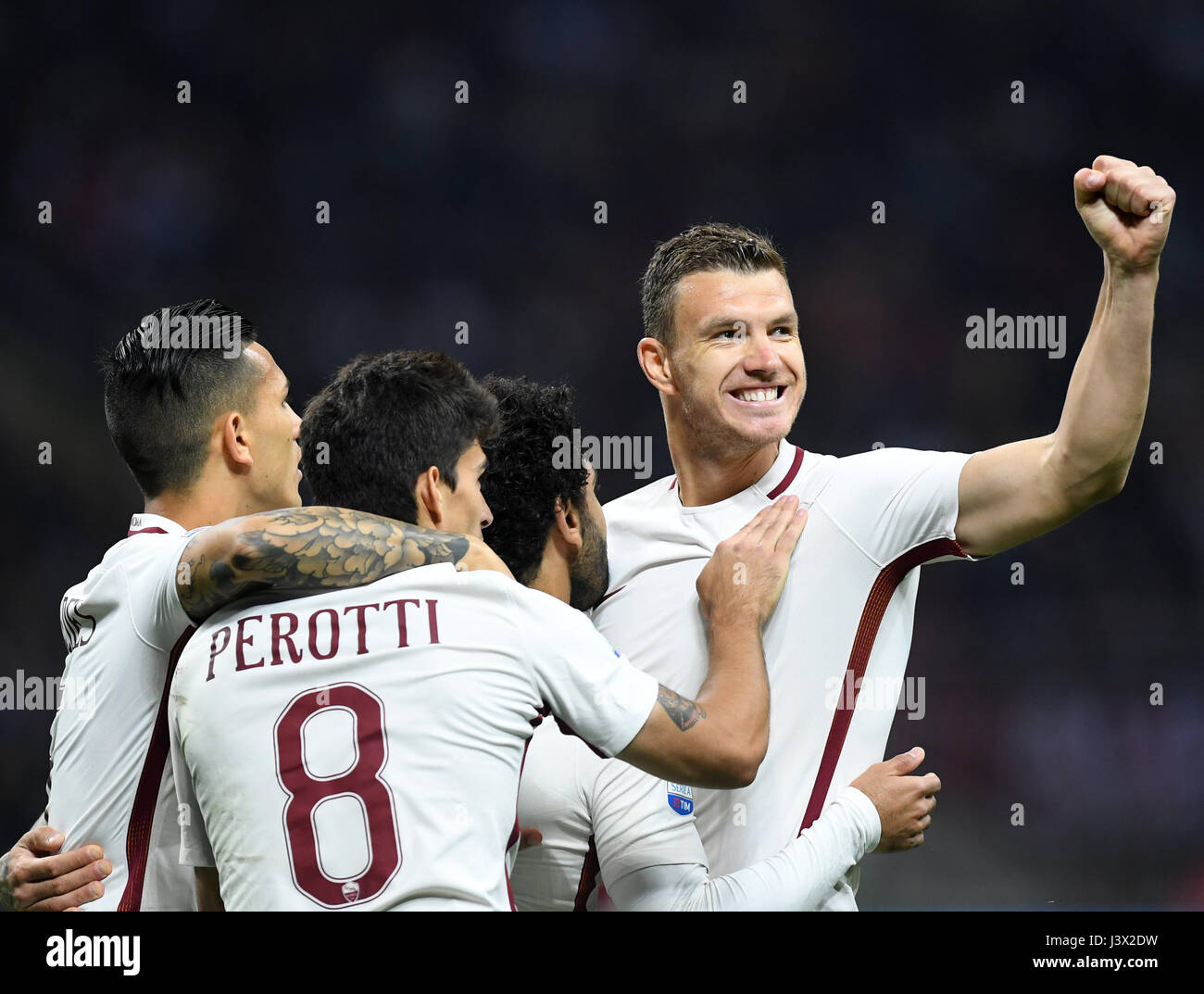 Milan, Italy. 7th May, 2017. Edin Dzeko(1st R) of Roma celebrates his ...