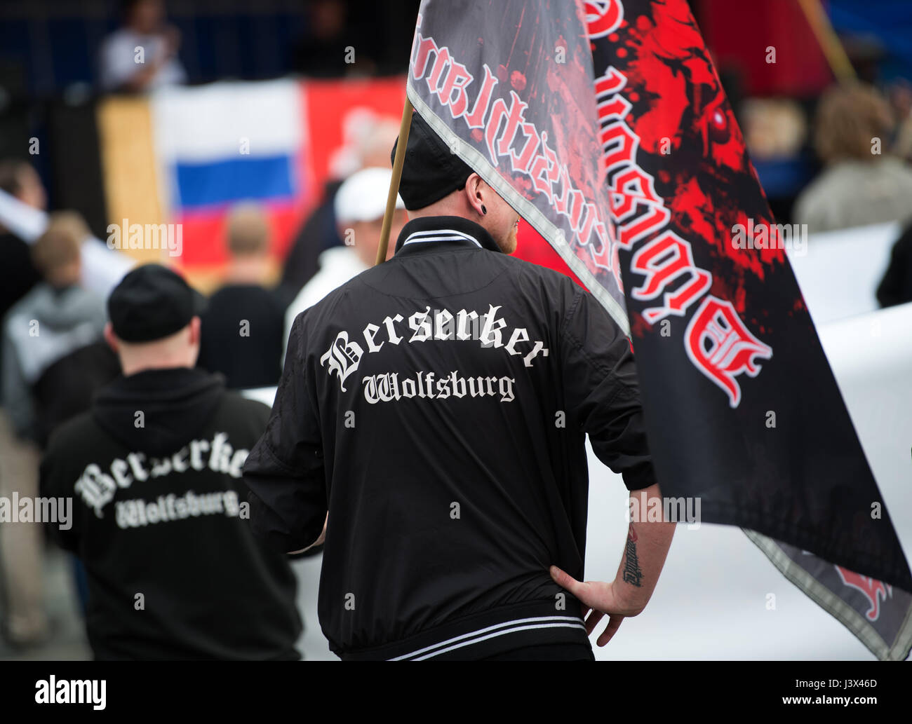 Dresden, Germany. 6th May, 2017. Participants at a pro-Le Pen demonstration wear 'Berserker Wolfsburg' jumpers in front of the Church of Our Lady in Dresden, Germany, 6 May 2017. Berserker Wolfsburg is an organisation with far-right and neo-fascist sympathies associated with the football hooligan scene. Photo: Arno Burgi/dpa-Zentralbild/dpa/Alamy Live News Stock Photo