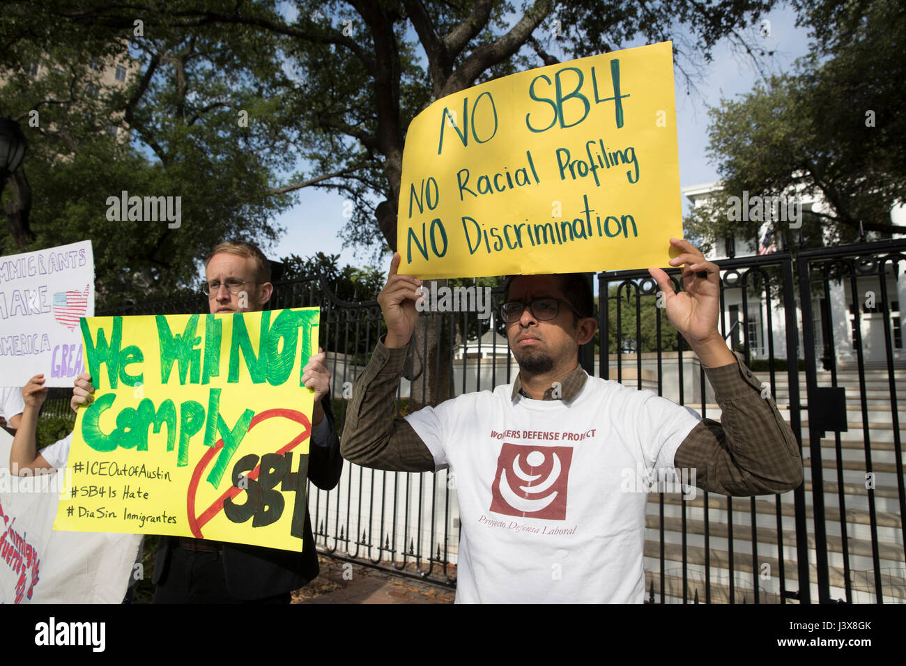 Austin, Texas, USA. 8th May, 2017. Immigrant Texans protest at the Texas Governor's Mansion downtown Austin after Gov. Greg Abbott privately signed on Faebook Live an anti-immigrant bill that would require Texas police officers to question immigration status on detained suspects. Credit: Bob Daemmrich/Alamy Live News Stock Photo