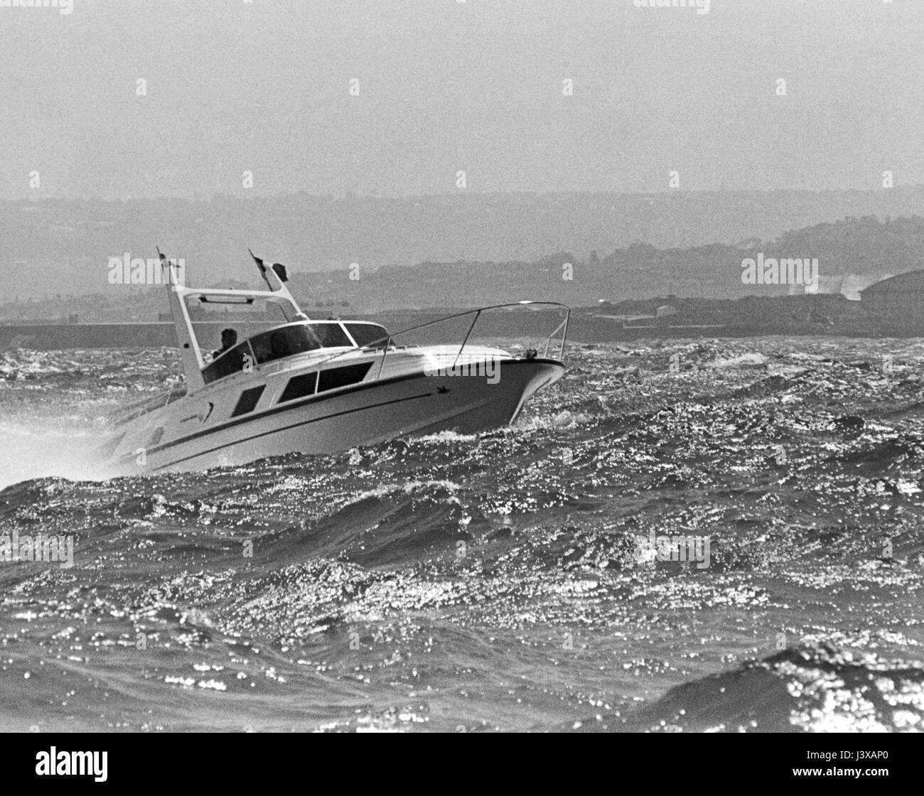 AJAXNETPHOTO. CHERBOURG, FRANCE. - HEAVY SEAS - BRITISH FAIREY FANTOME MOTOR CRUISER BASTA IN HEAVY SEAS OFF THE FRENCH COAST. PHOTO:JONATHAN EASTLAND/AJAX REF:MBY0773 1 Stock Photo