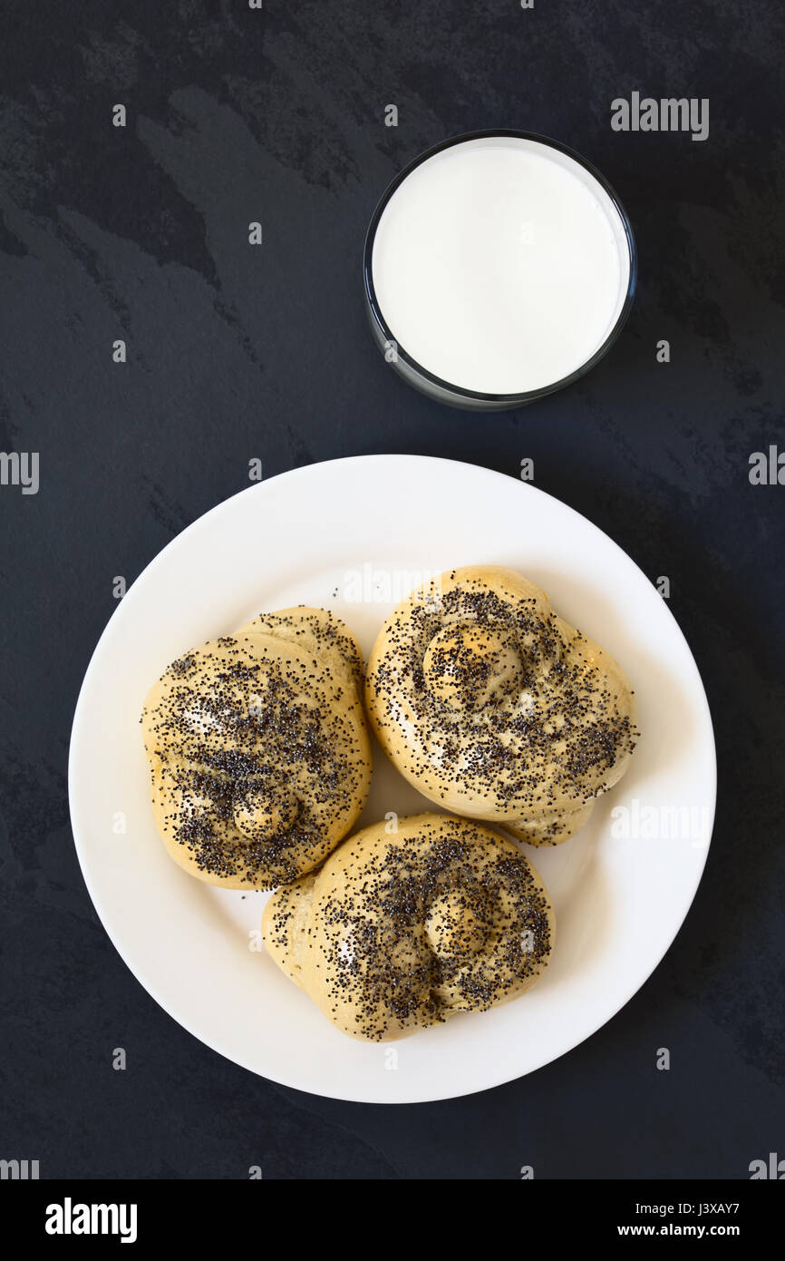 Homemade Poppy Seed Bread Rolls On Plate With A Glass Of Milk
