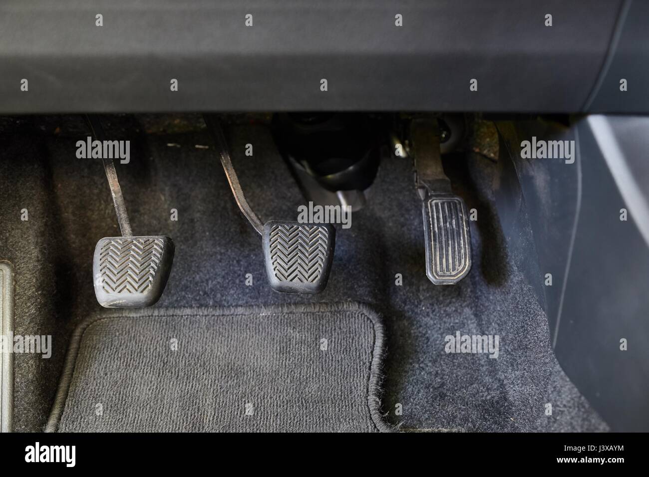Pedals of a car driving manual gearbox Stock Photo Alamy