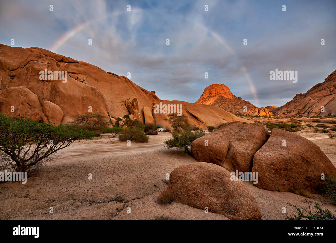 rainbow over Spitzkoppe, mountain landscape of granite rocks, Namibia Stock Photo