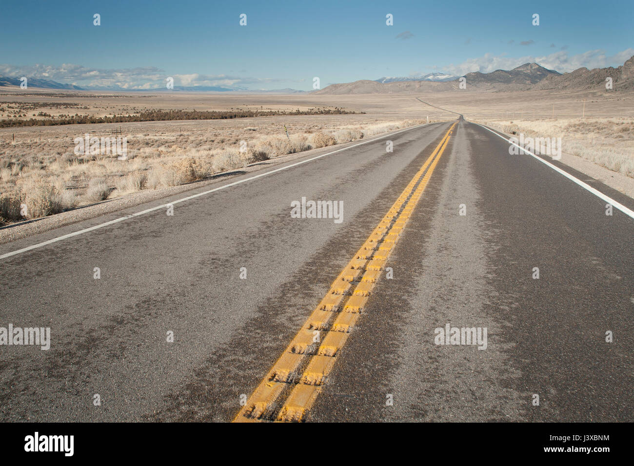 Wide open road with no vehicles. Nevada, USA. Stock Photo