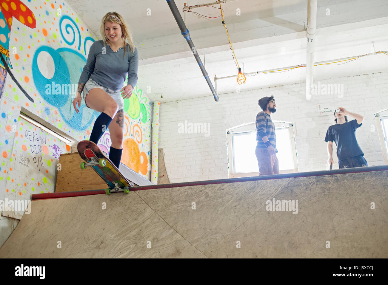 Group of young adults at skating rink Stock Photo Alamy