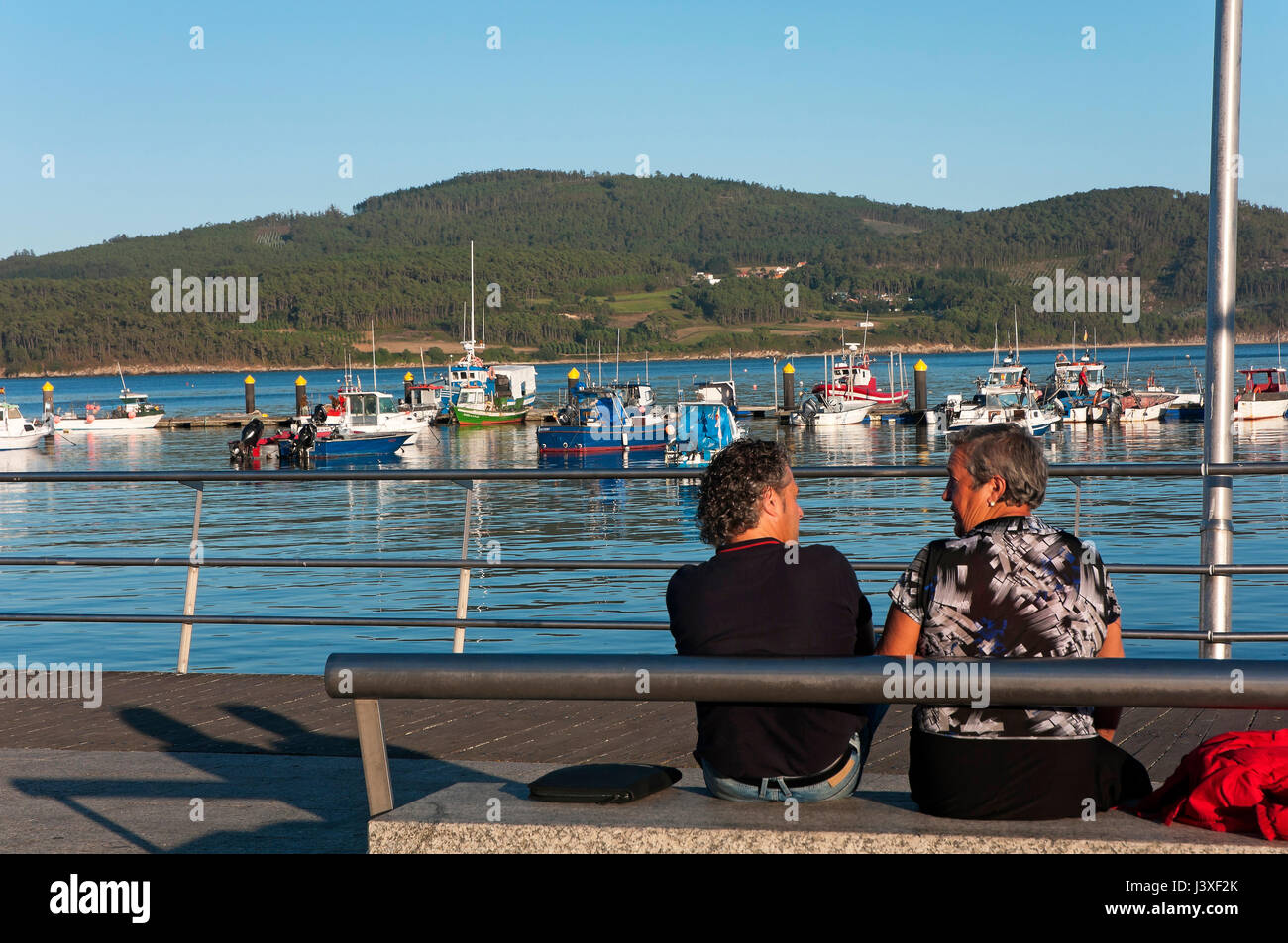 Fishing port and people chatting, Camarinas, La Coruna province, Region of Galicia, Spain, Europe Stock Photo