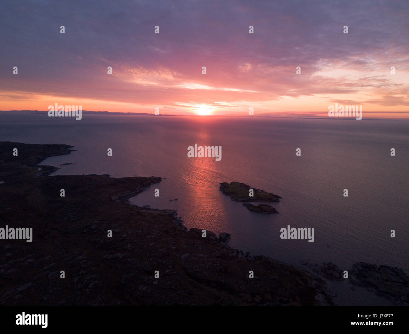 Aerial view of sunset over the Scottish Highlands near Poolewe looking out over the Atlantic ocean Stock Photo