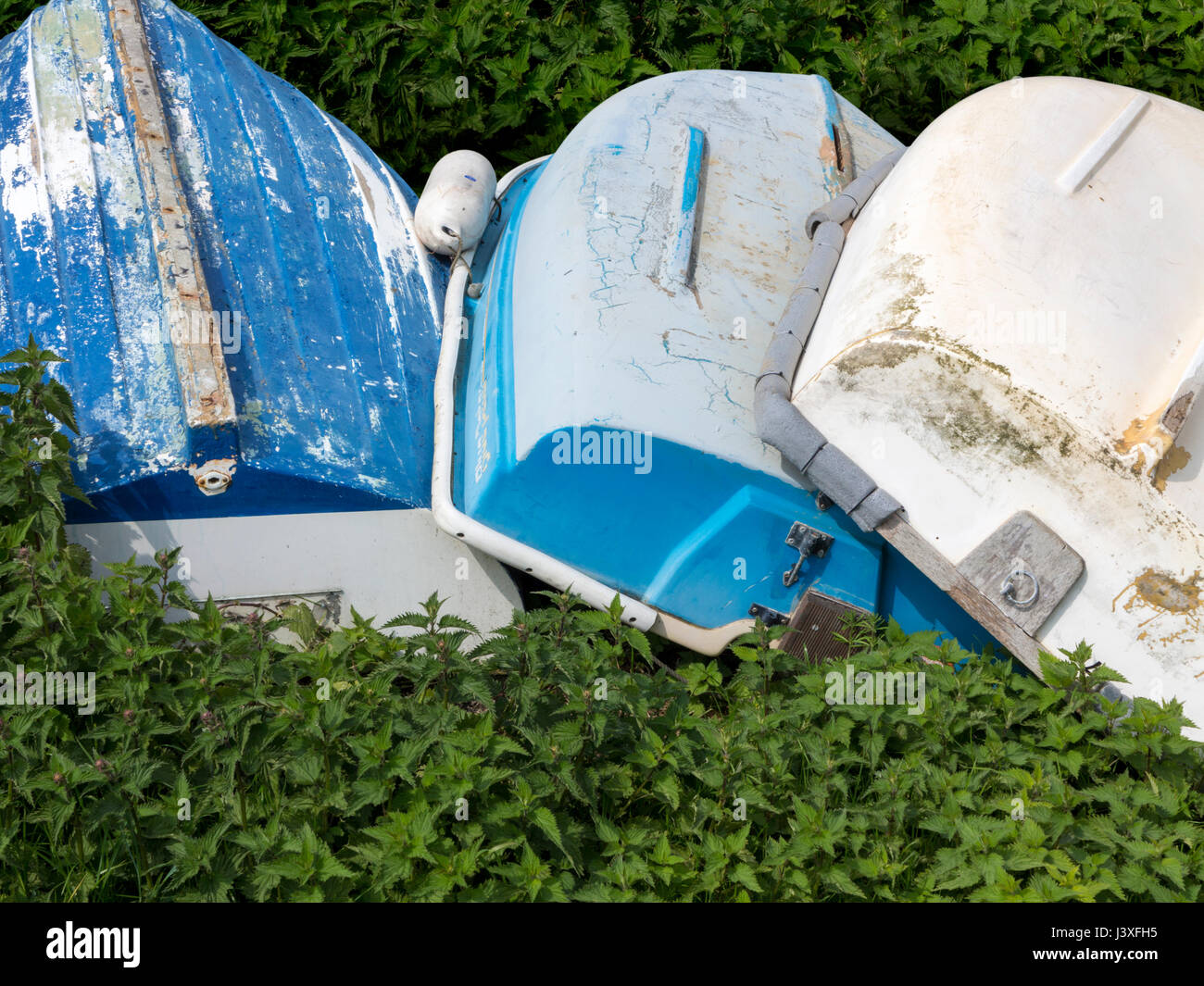 Sailing dinghys stacked in a boat yard Stock Photo
