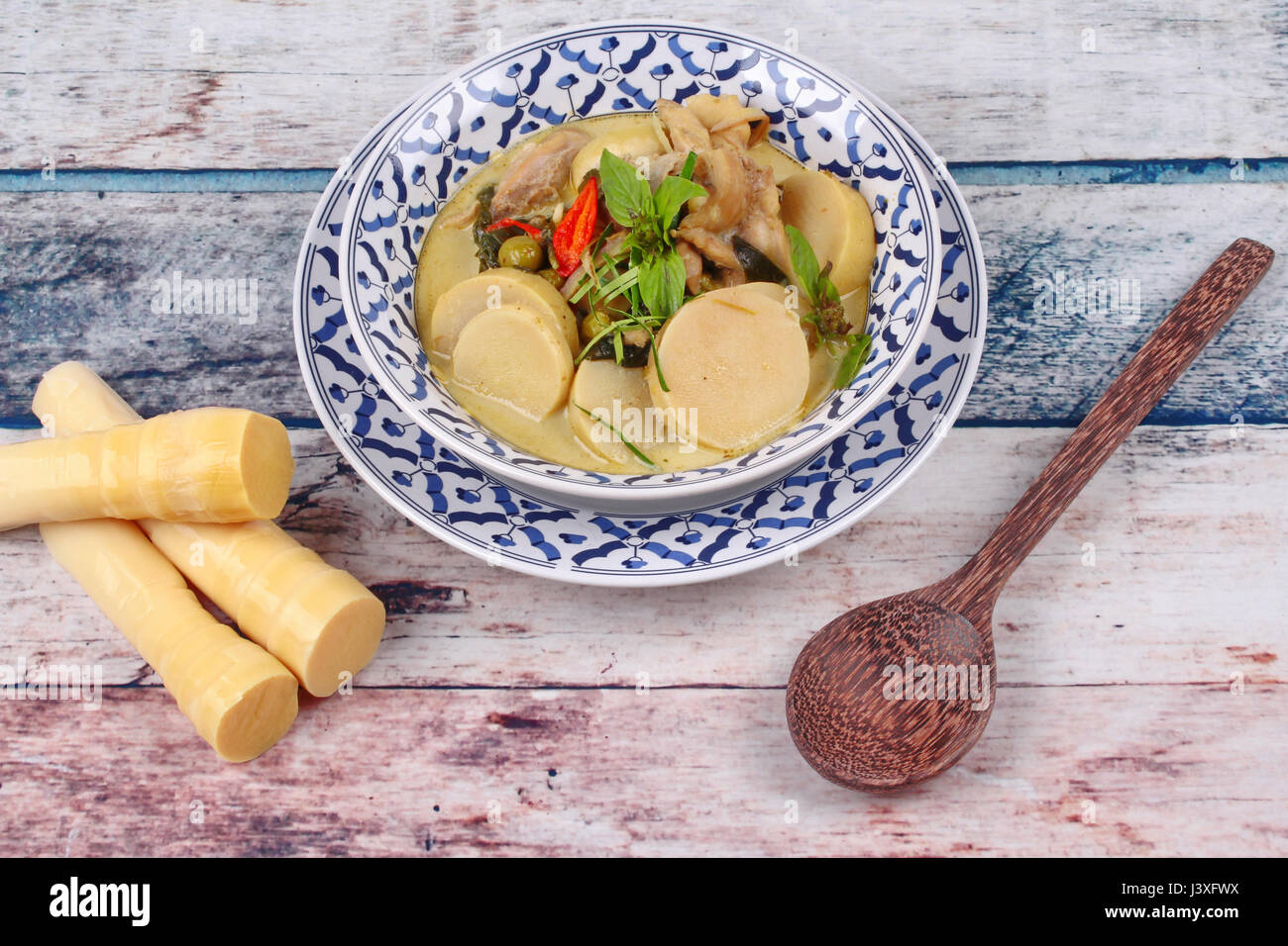 Thai recipe, Green chicken curry in coconut milk with soft bamboo pole
