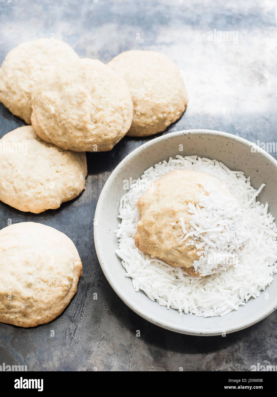 Biscuits and bowl of shredded coconut Stock Photo Alamy