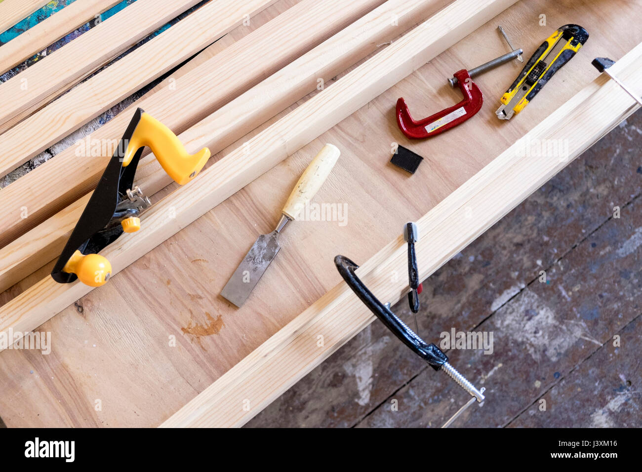 Overhead view of carpentry equipment on wooden workbench Stock Photo