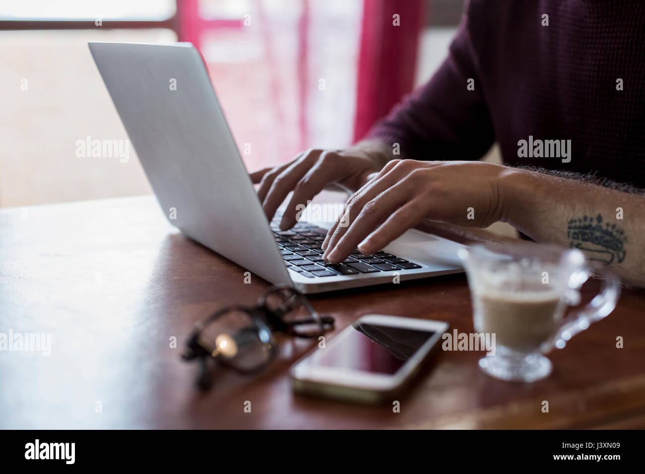 Using computer at home Stock Photo - Alamy