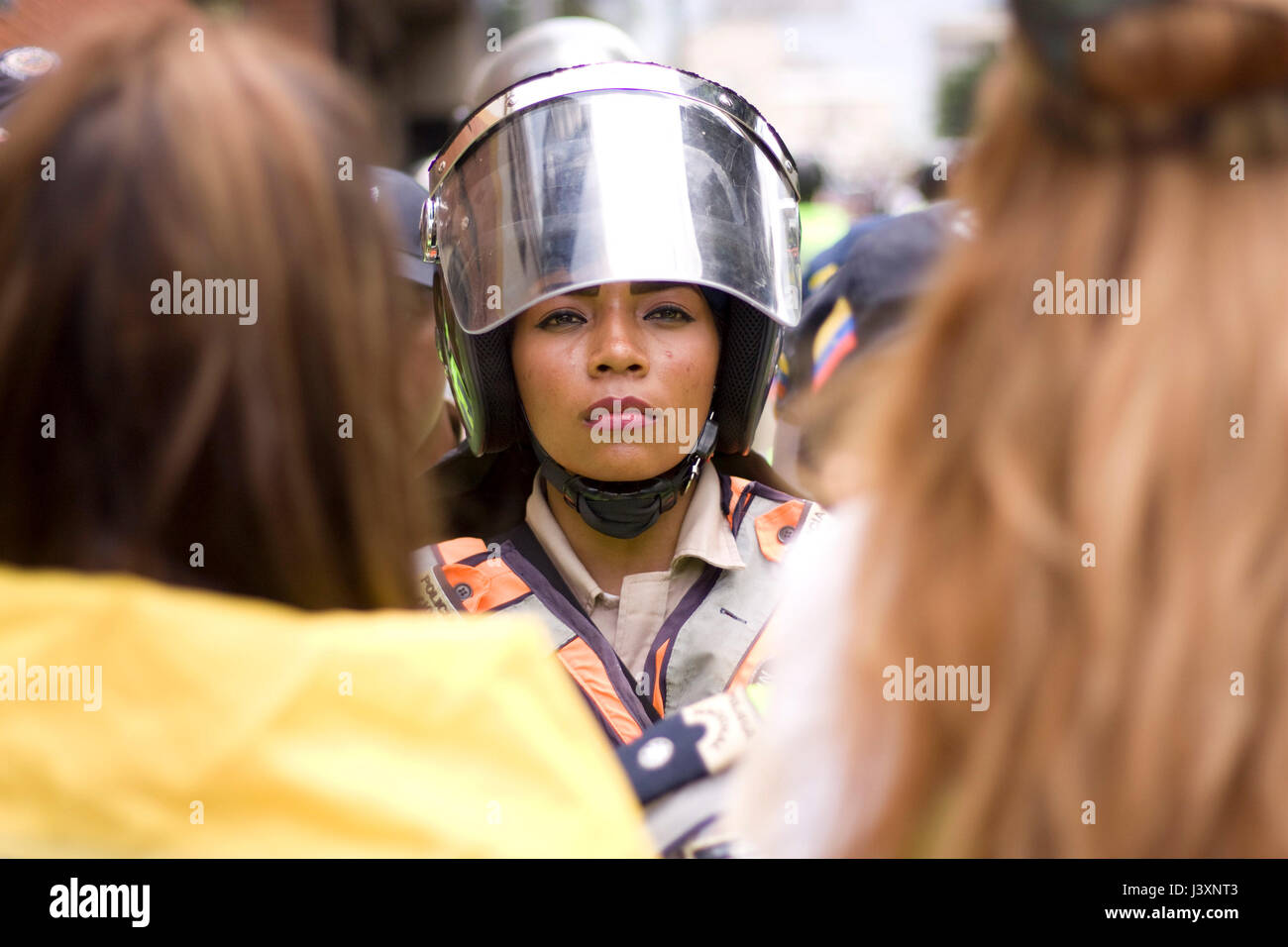 A police woman with anti riots equipment in Caracas Stock Photo