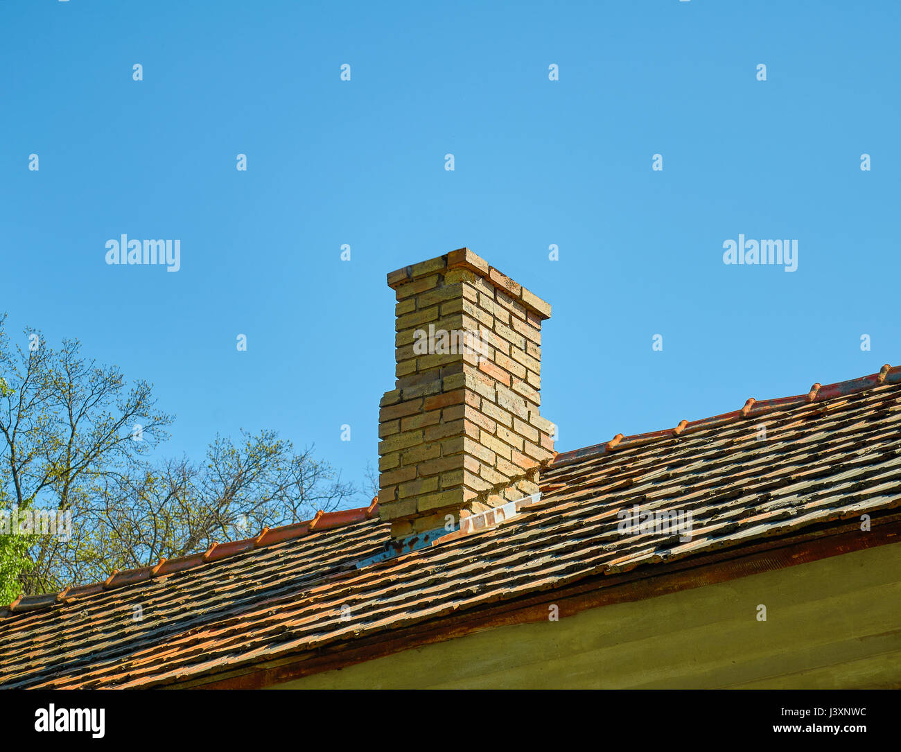 brick chimney against the blue sky Stock Photo - Alamy