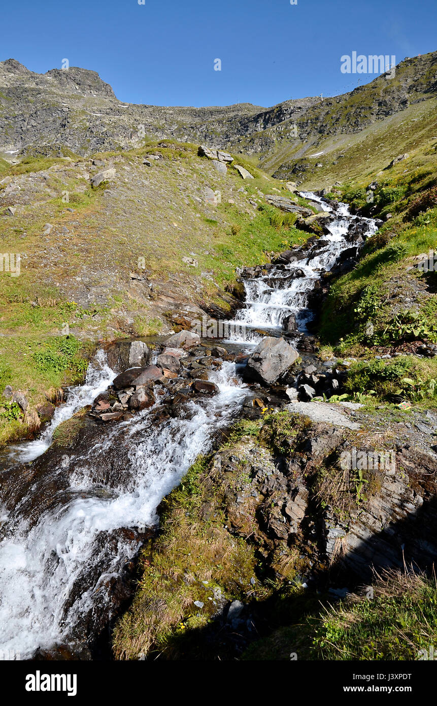 Stream in the French Alps near of Col du Petit-Saint-Bernard (Little St Bernard Pass), Rhône-Alpes region in France Stock Photo