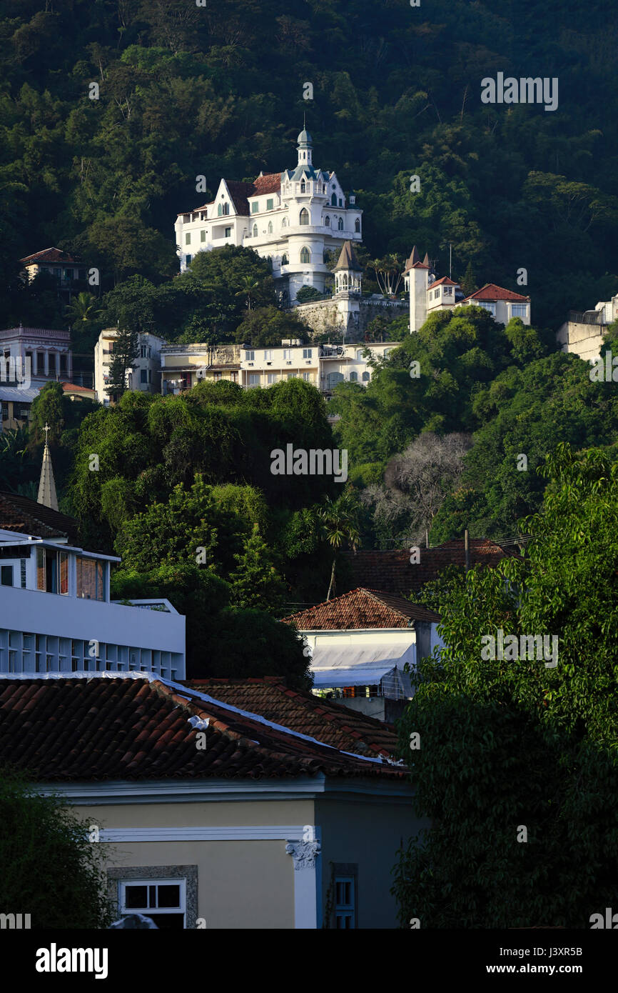 Roofs in Santa Teresa with Tijuca forest & the Castelinho (Castelo Valentim) 19th Century castle - now a rental guest house, Rio de Janeiro, Brazil Stock Photo