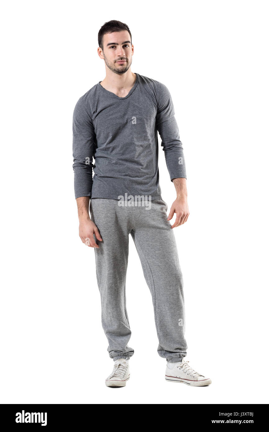 Cool relaxed fit man in sportswear looking at camera. Full body length  portrait isolated on white studio background Stock Photo - Alamy