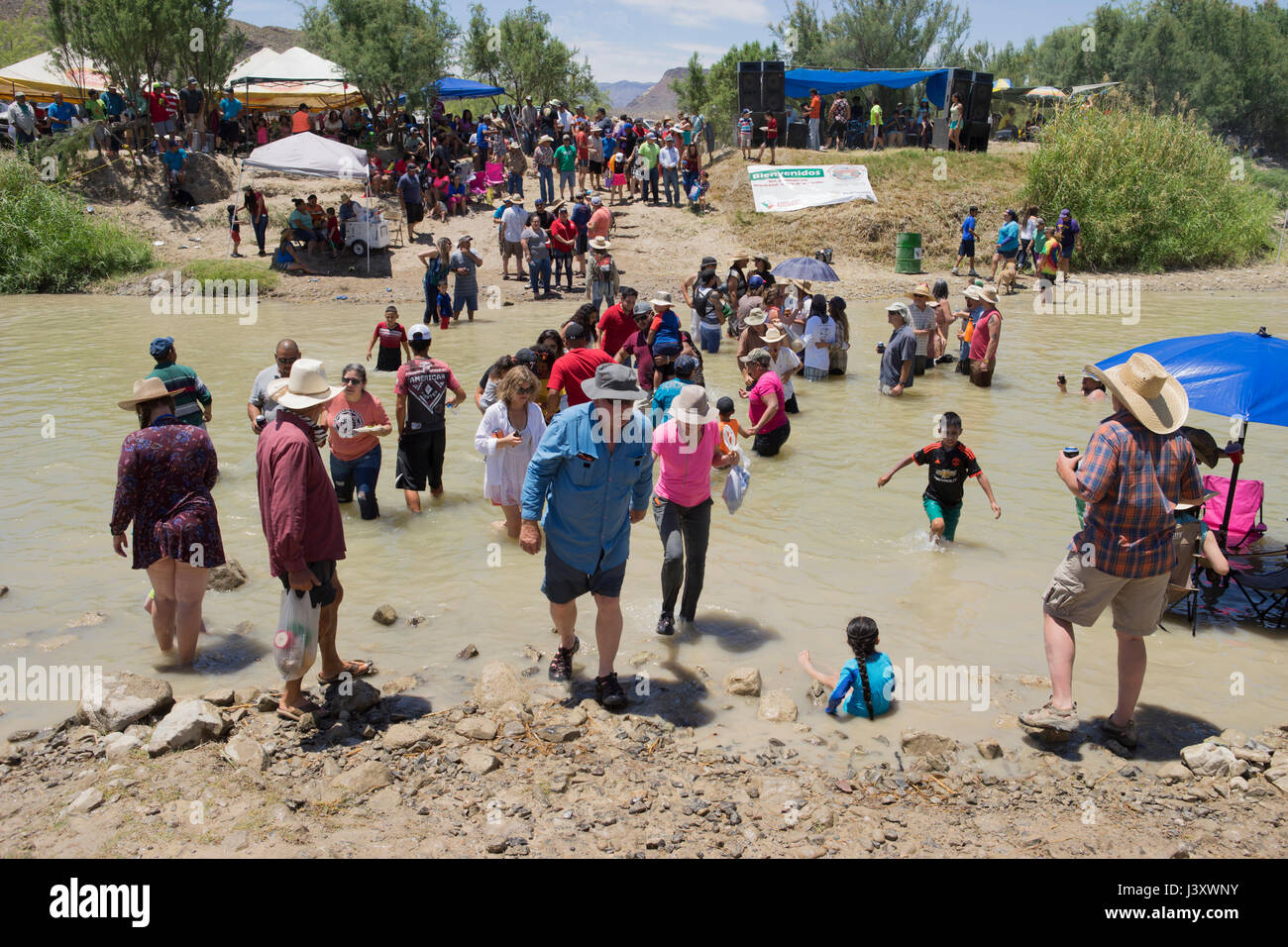Fiesta Protesta participants, an annual demonstration again the closing of part of the US-Mexican border, gather in the Rio Grande in Lajitas, Texas. Stock Photo