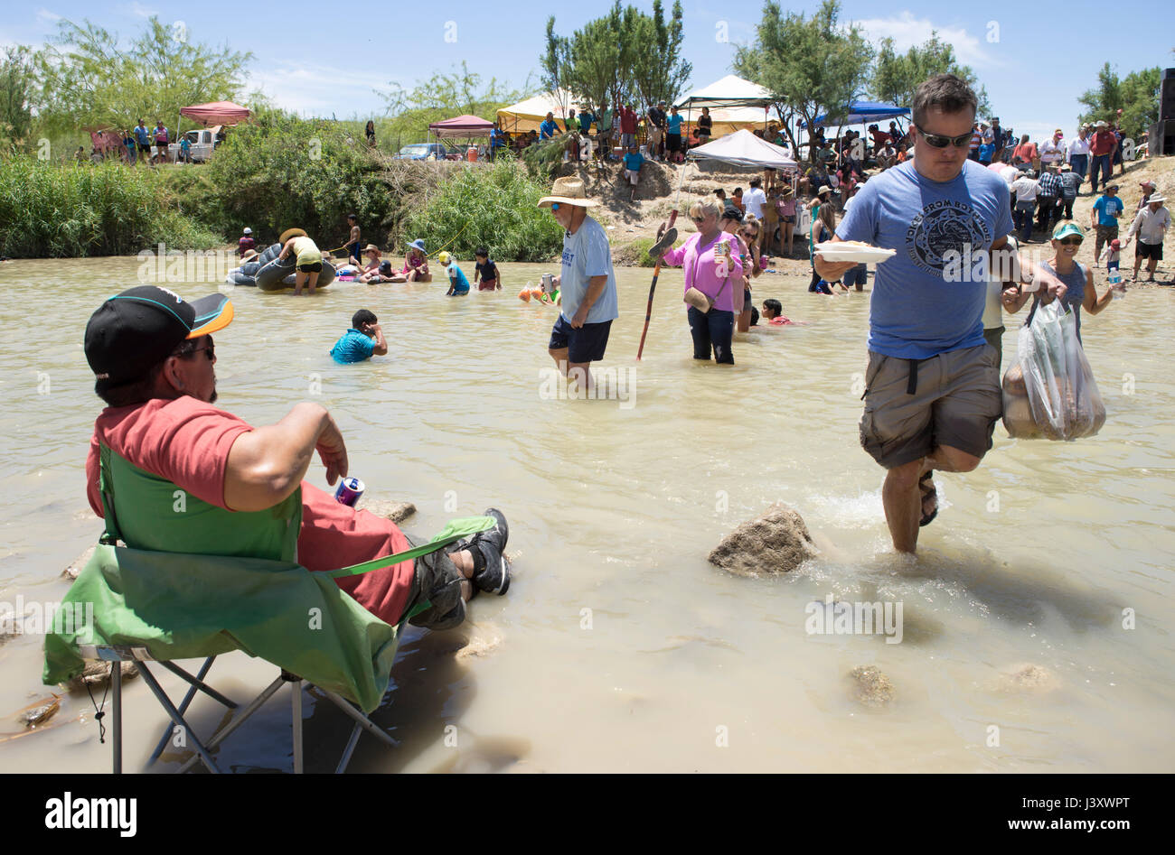 Fiesta Protesta participants, an annual demonstration again the closing of part of the US-Mexican border, gather in the Rio Grande in Lajitas, Texas. Stock Photo