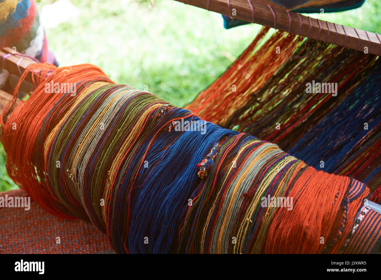 Traditional peruvian textile close-up on blurred background. Colorful woolen fabric Stock Photo