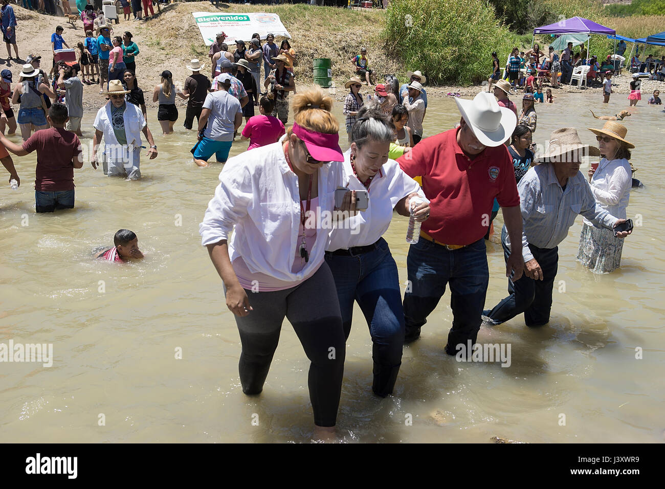 Fiesta Protesta participants, an annual demonstration again the closing of part of the US-Mexican border, gather in the Rio Grande in Lajitas, Texas. Stock Photo