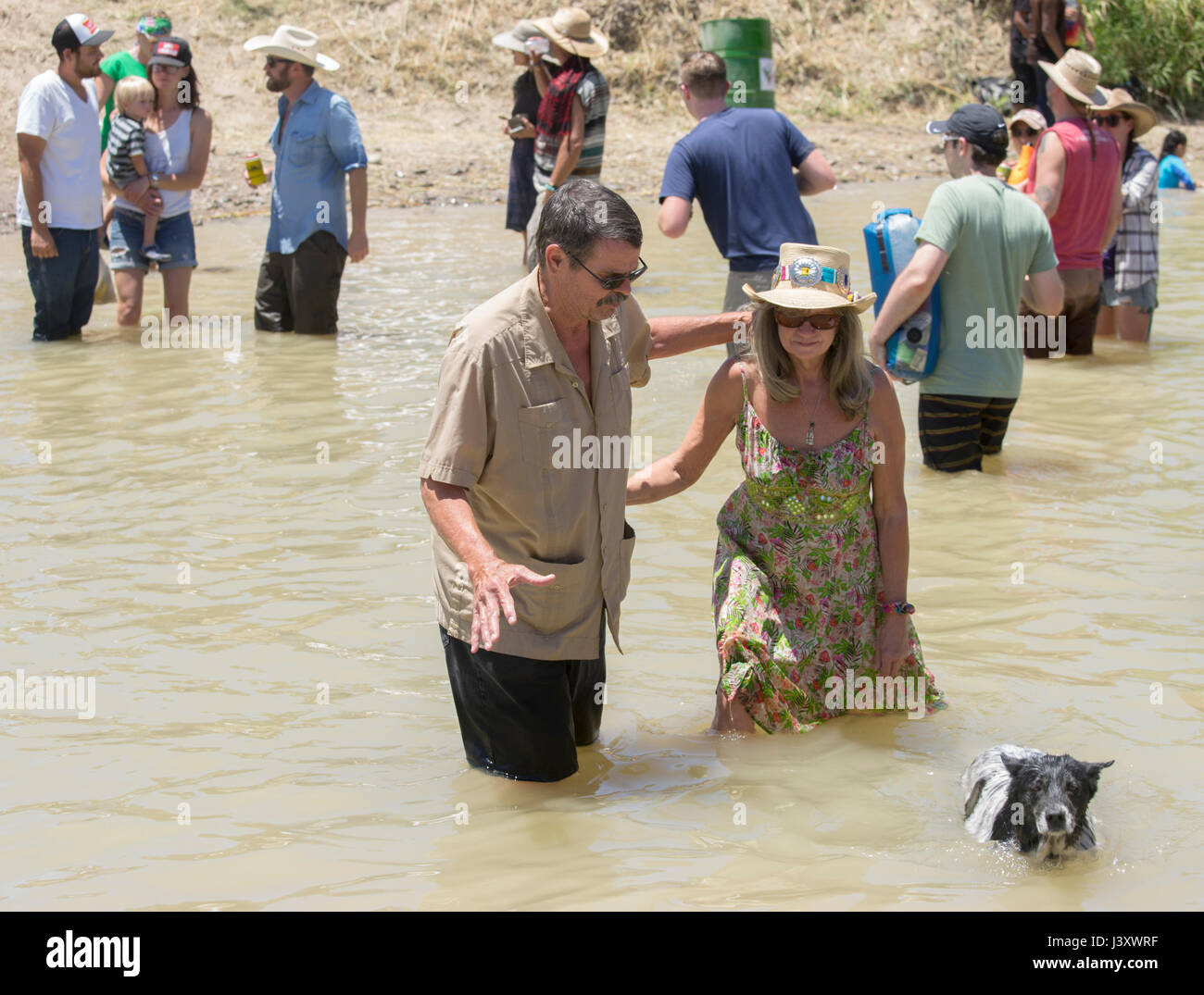 Fiesta Protesta participants, an annual demonstration again the closing of part of the US-Mexican border, gather in the Rio Grande in Lajitas, Texas. Stock Photo