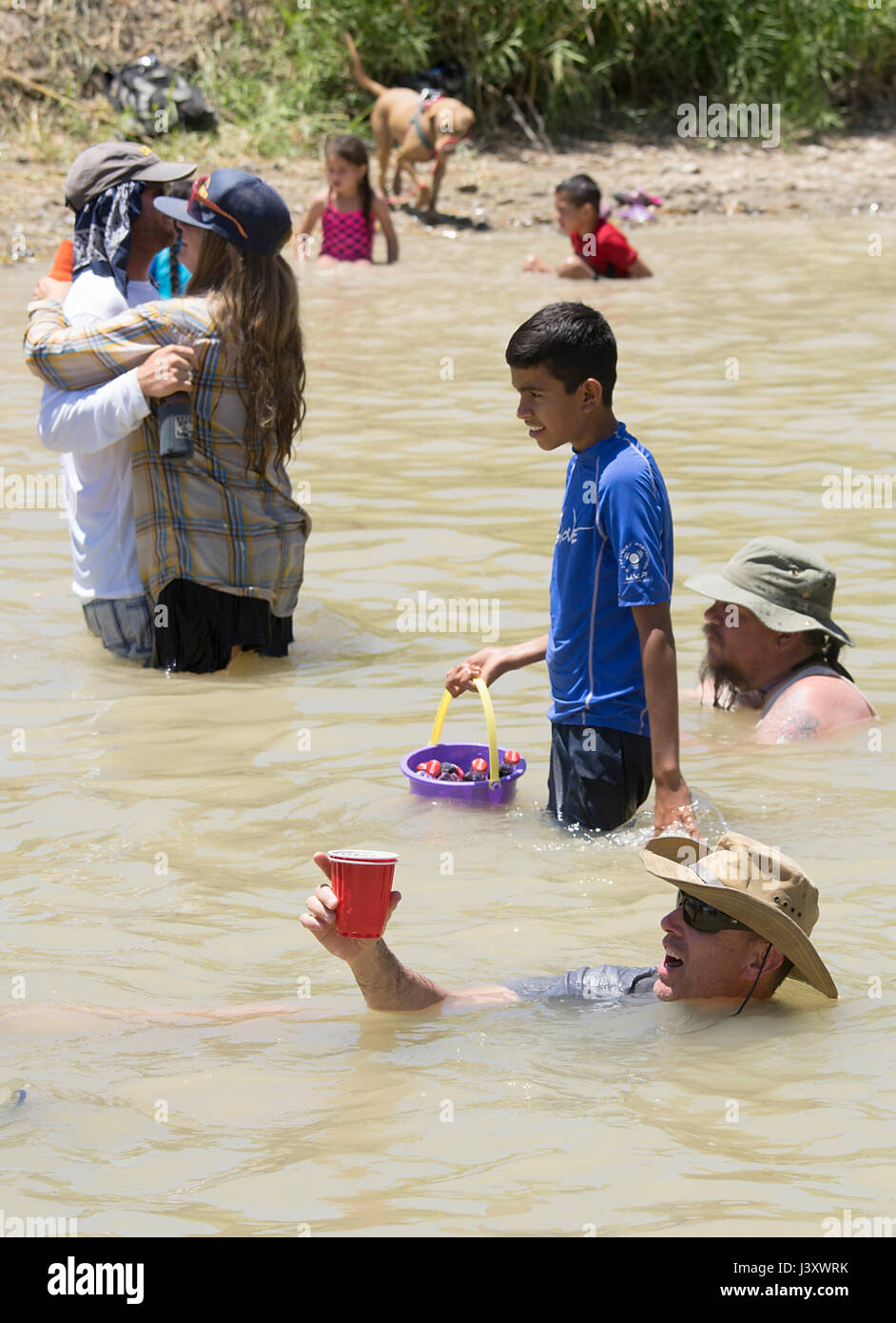 Fiesta Protesta participants, an annual demonstration again the closing of part of the US-Mexican border, gather in the Rio Grande in Lajitas, Texas. Stock Photo