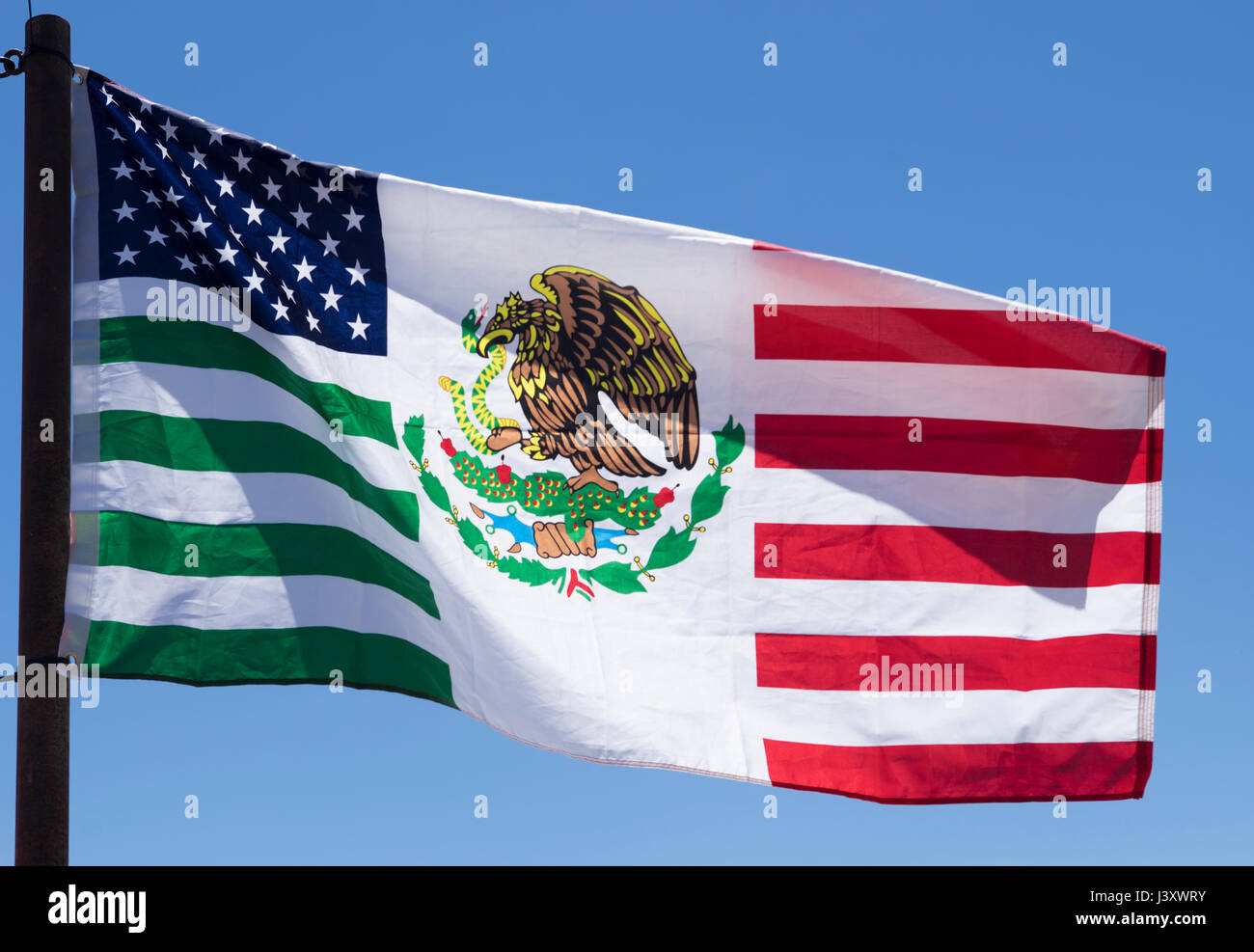 A flag intended to celebrate the American-Mexican friendship flies during the Fiesta Protesta annual demonstration held in Lajitas, Texas. Stock Photo