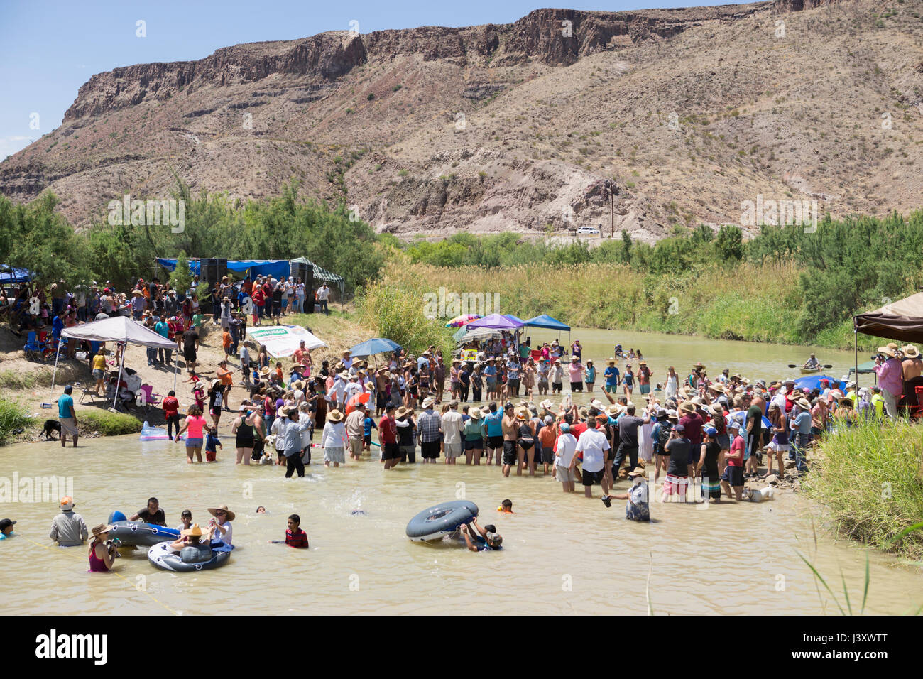 Fiesta Protesta participants, an annual demonstration again the closing of part of the US-Mexican border, gather in the Rio Grande in Lajitas, Texas. Stock Photo