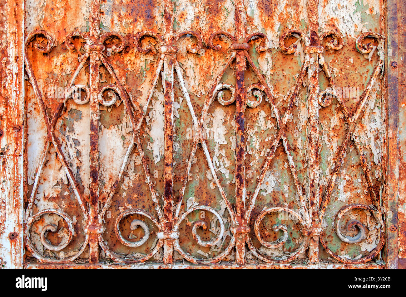 Rusty ornamental iron fence background Stock Photo - Alamy