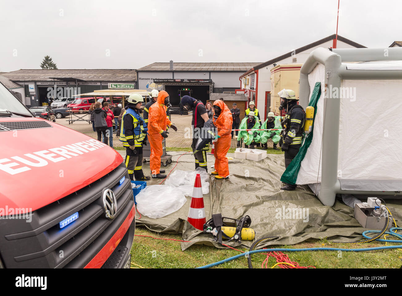 Fireman demonstrate how to handle hazardous material public