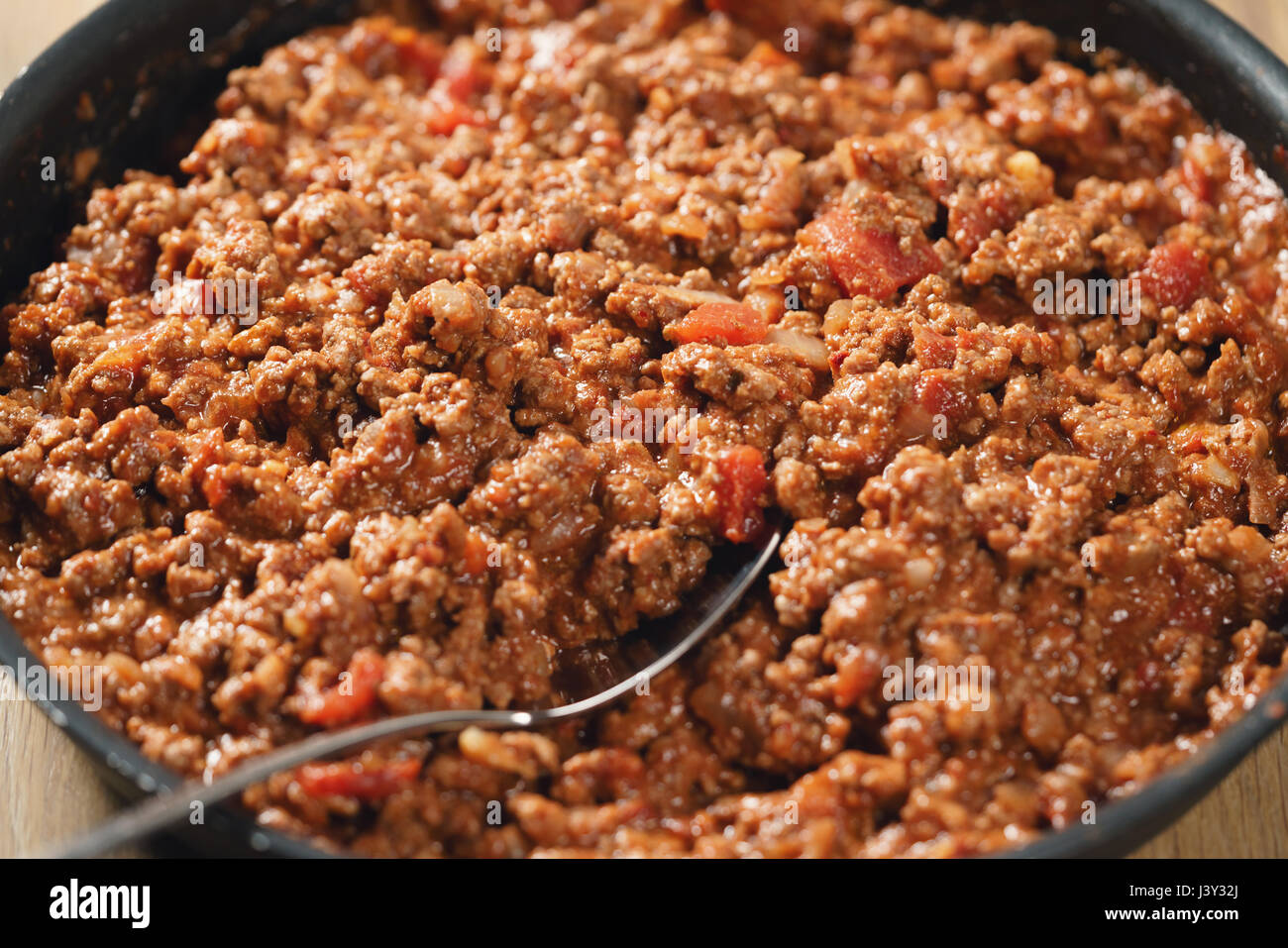 preparing lasagna process with bolognese sauce in pan Stock Photo