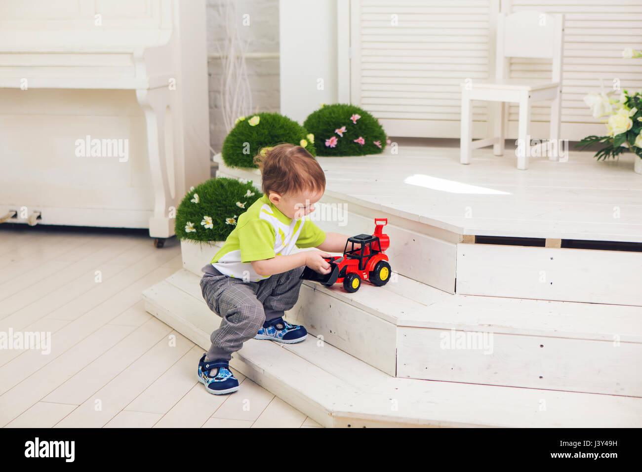 Little boy is playing with toy car at home Stock Photo - Alamy
